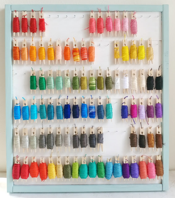 DIY Embroidery Floss Organizer using Clothespins featured by top US craft blog, Ameroonie Designs: image of DIY storage for embroidery floss wrapped on clothespins