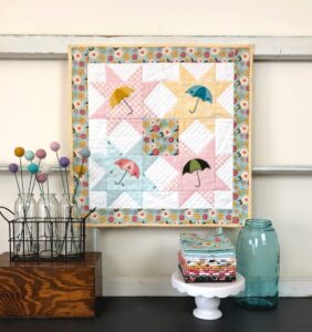 Mini quilt pattern with Sister Prairie fabrics, featured by top US quilting blog, Ameroonie Designs