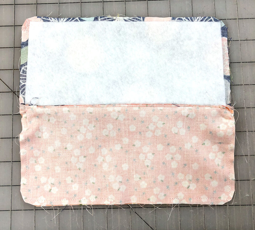 Sew the outside and lining of the zipper pouch together.