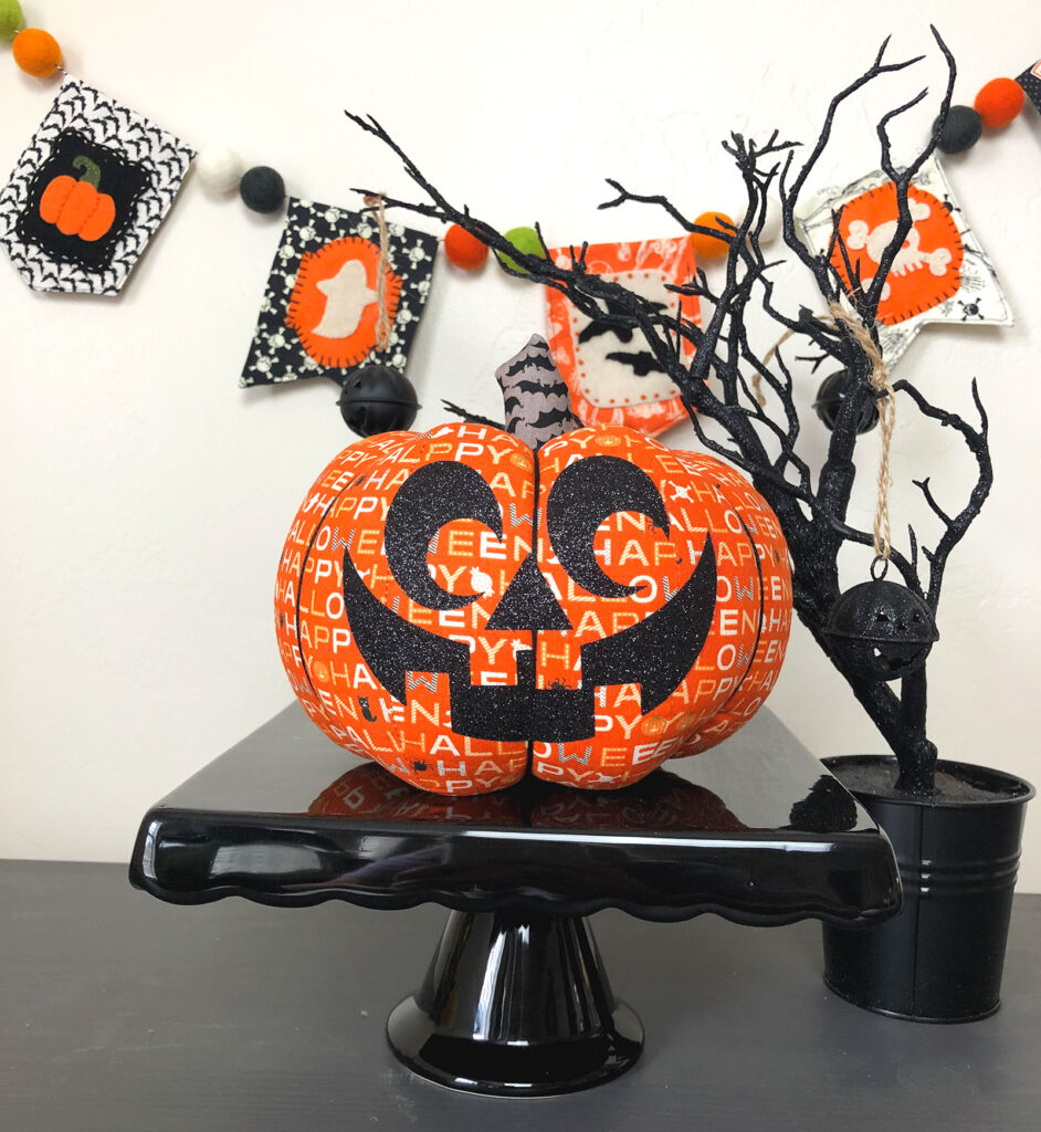 Remove protective lining to reveal fabric jack o lantern.