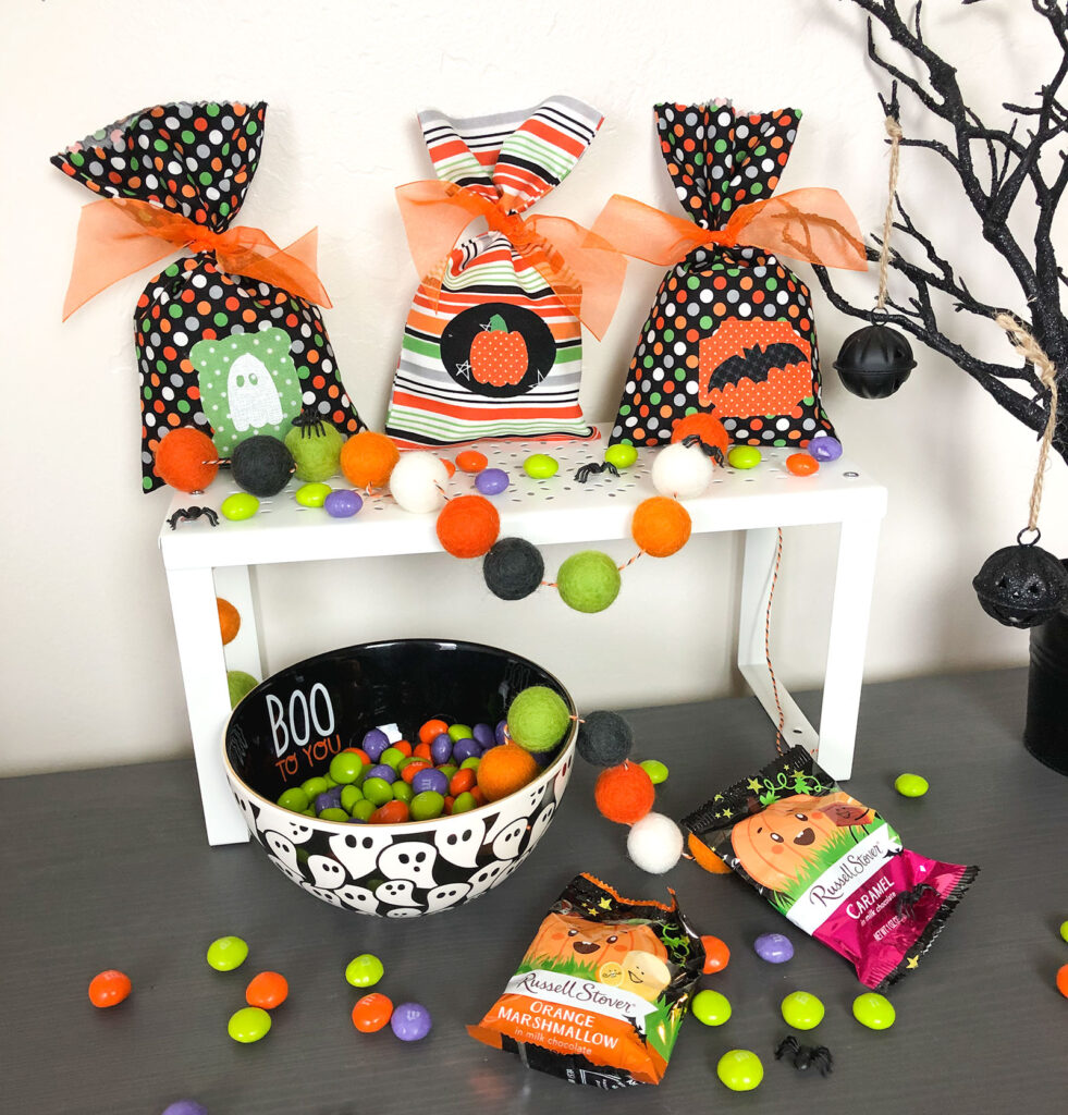 Fill treat bags with candy or prizes and tie shut with ribbon.