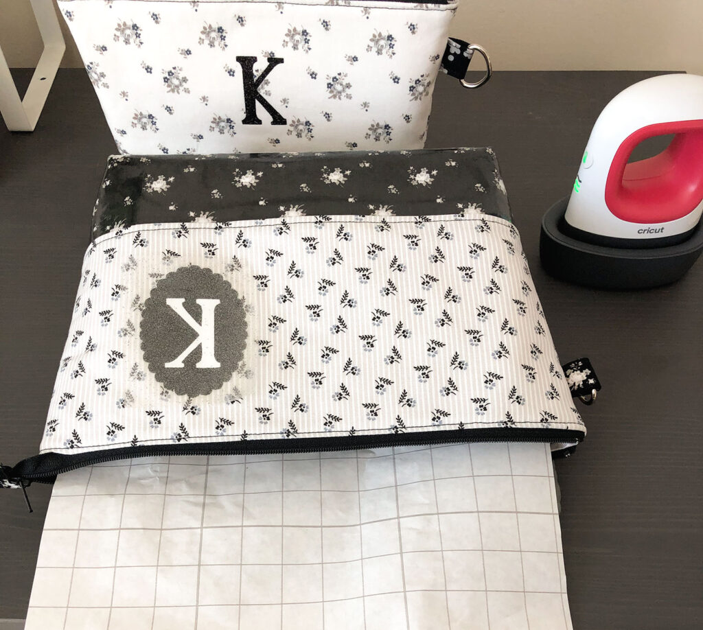 Personalized Zipper Pouch Tutorial featured by top US sewing blog Ameroonie Designs: Protect lining of pouch by inserting paper backing before fusing monogram.