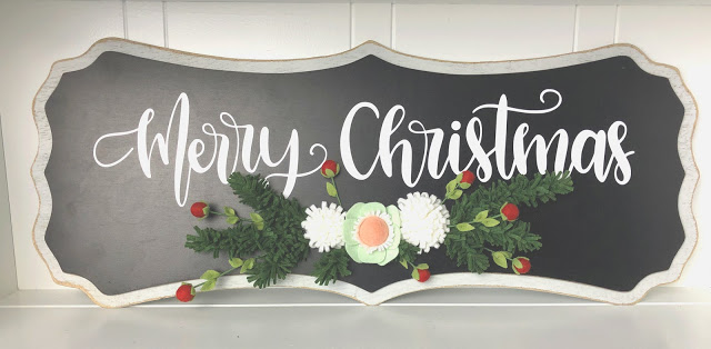 felt flowers decorate a Merry Christmas sign