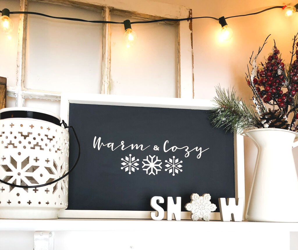 DIY Winter Decor Sign from top US craft blogger Ameroonie Designs: image of black and cream sign with phrase Warm and Cozy.