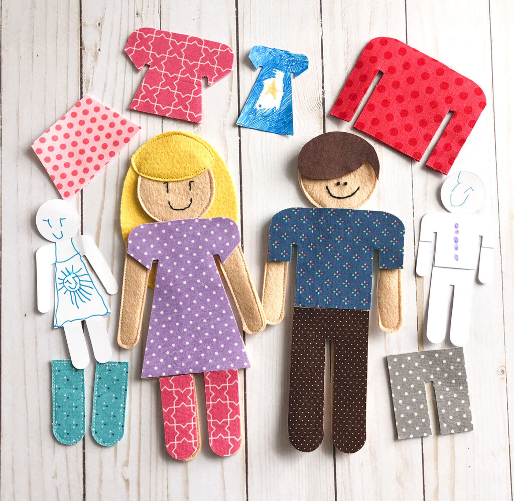 Amazing Cricut Projects to make at home by Top US craft blog Ameroonie Designs. Image of Paper and felt dolls made using Cricut Maker.