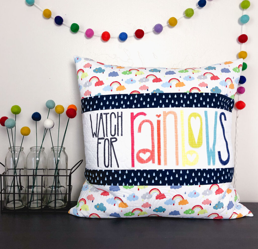 Watch for Rainbows Pillow Tutorial by Top US sewing blog Ameroonie Designs. Image of: pillow with pom flowers and garland