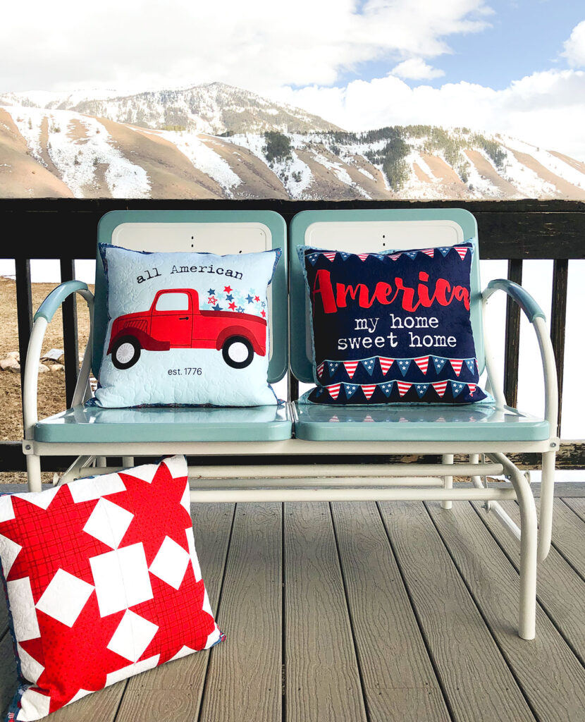 Patriotic Porch Pillow Tutorial by Top US sewing blog Ameroonie Designs. Image of: Fourth of July themed pillows with mountain background.