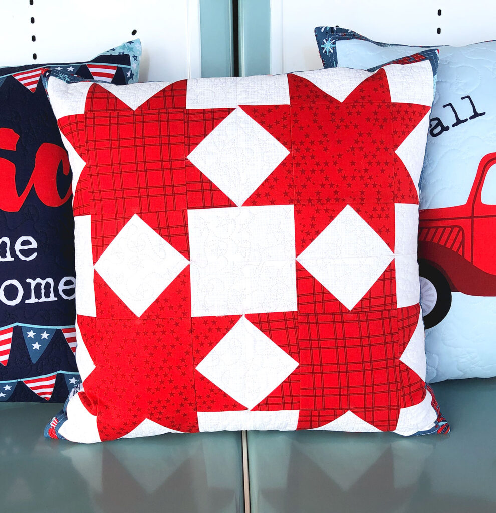 Patriotic Porch Pillow Tutorial by Top US sewing blog Ameroonie Designs. Image of: star pillow using Sawtooth stars quilt block.