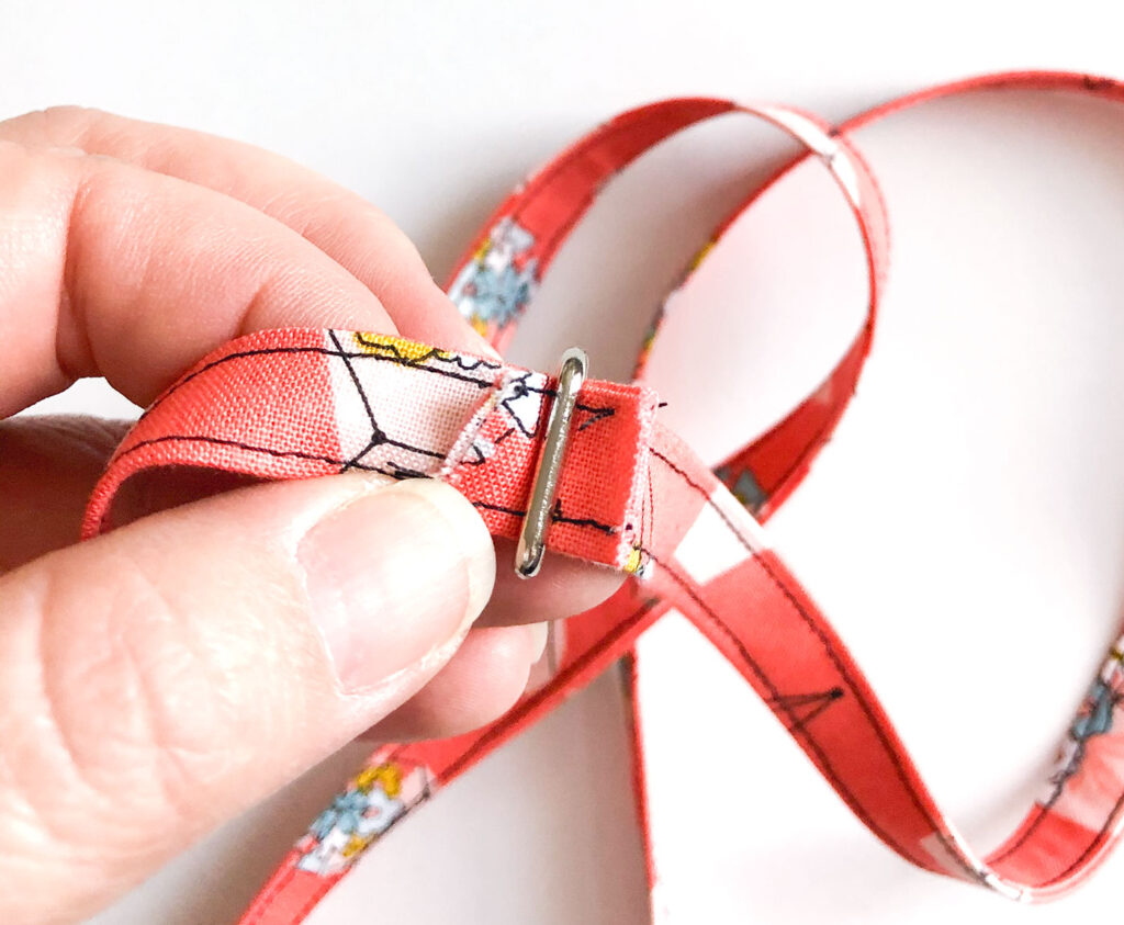 Fabric Lanyard Tutorial by Top US sewing blog Ameroonie Designs image of: positioning lobster clasp within seam allowance.