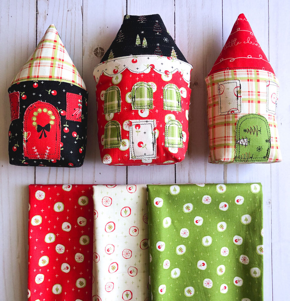 Fabric Christmas Village by Top US sewing blog Ameroonie Designs image of: stuffed fabric houses and prints from Merry Little Christmas fabric line.