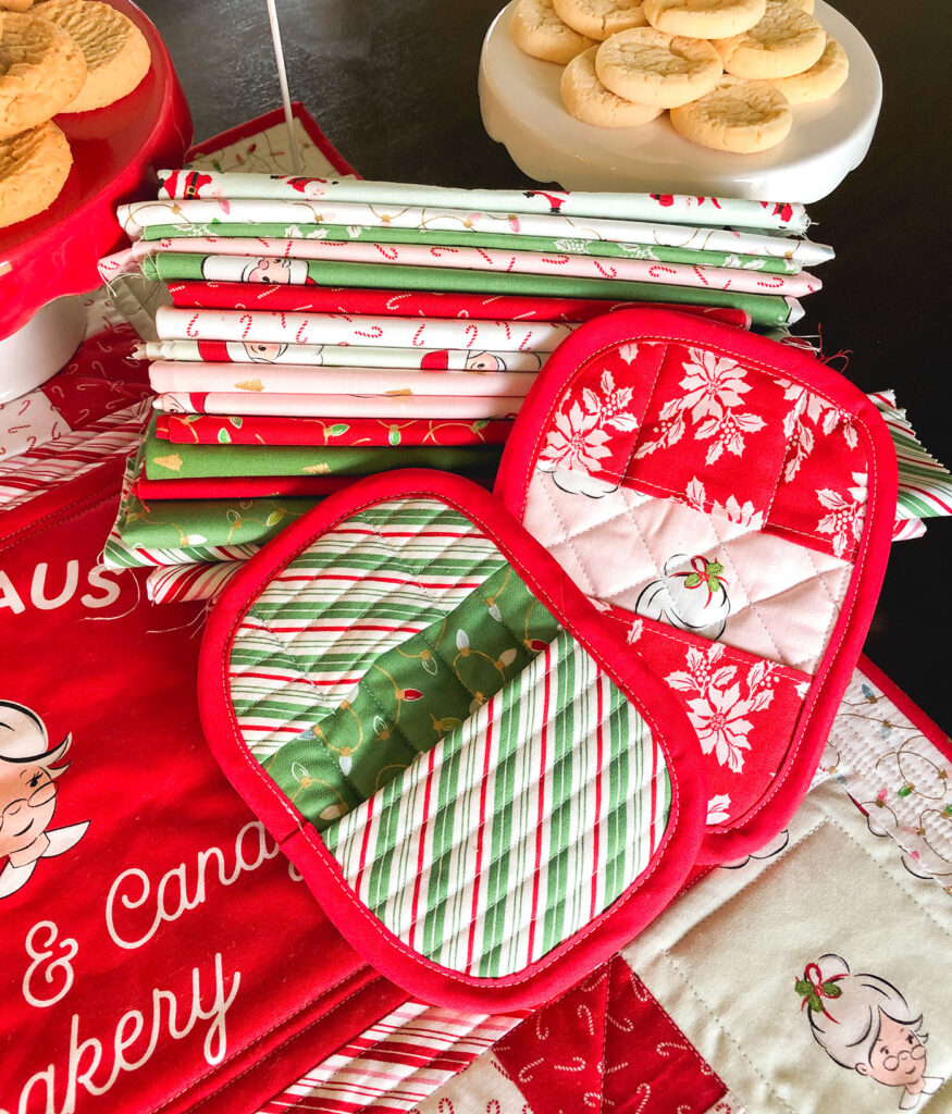 How to Sew a Hot Pad with Pockets by top US sewing blog Ameroonie Designs. Image of: hot pads, cookies and Santa Claus lane fabric.