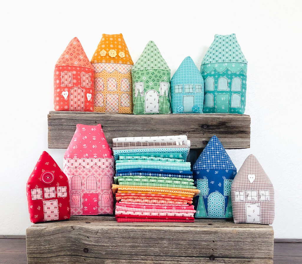 Rainbow Village with Prim fabric by Top US sewing blog Ameroonie Designs: image of stuffed fabric houses.