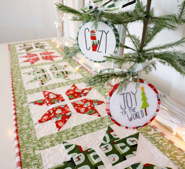 Snowflake table runner with Free Pattern, a tutorial featured by top US sewing blog, Ameroonie Designs: The joyful snowflake table runner is shown with coordinating embroidered ornaments