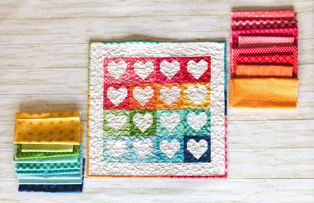 Heart Mini Quilt by top US sewing blog Ameroonie Designs. Image of: heart mini quilt with fabrics from Bee Basics line.