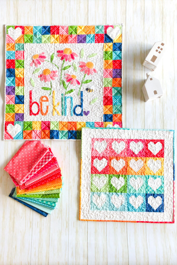 Heart Mini Quilt by top US sewing blog Ameroonie Designs. Image of: rainbow colored mini quilts.