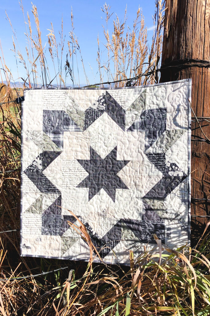 Fabric barn quilt by top US sewing blog Ameroonie Designs. Image of quilt with grasses.