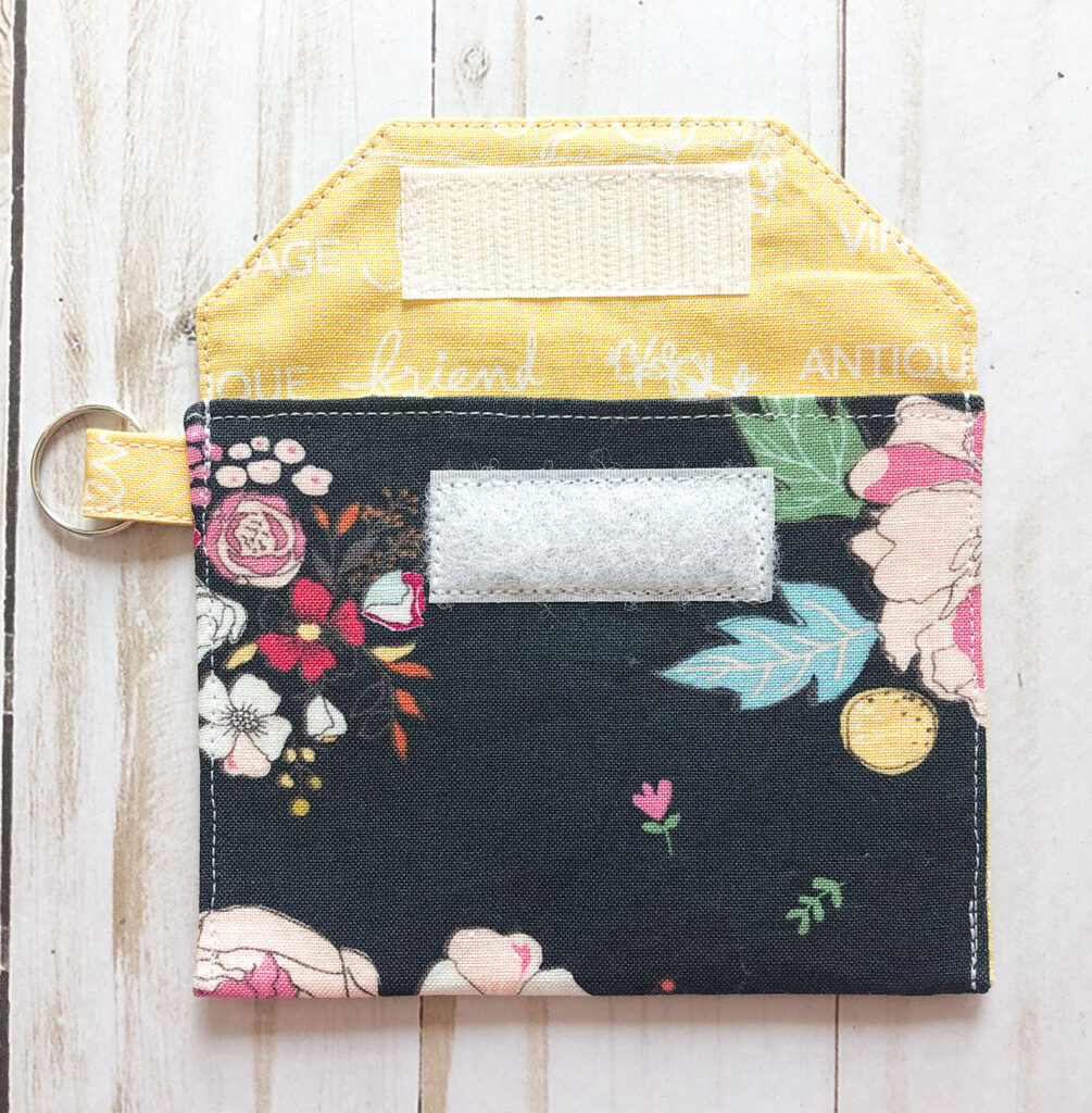 Accessorize your face mask tutorials by top US sewing blog Ameroonie Designs. Image of creating pocket in mask pouch.