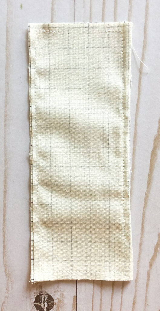 Scraptastic and simple Strip Pincushion by top US sewing blog Ameroonie Designs. Image of: preparing pouch for weight.