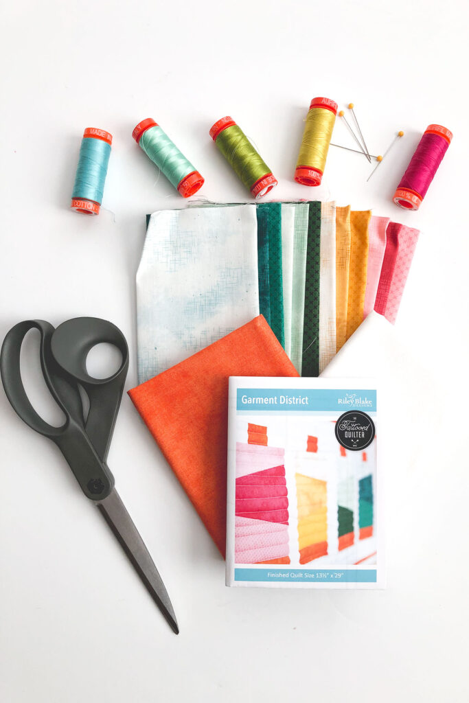 Fabric included in Garment District mini quilt kit with sewing supplies.