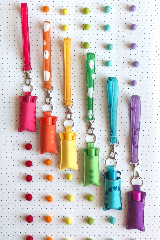 7 simple sewing projects to make this weekend from top US sewing blog Ameroonie Designs. Image of chapstick holders with wrist straps in rainbow order.