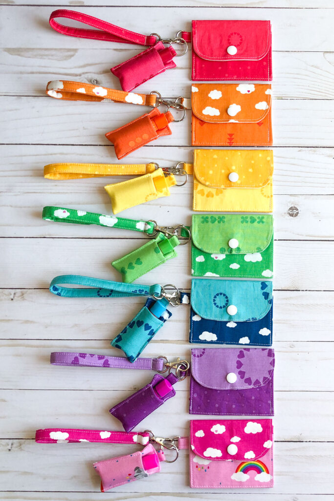 7 simple sewing projects to make this weekend from top US sewing blog Ameroonie Designs. Image of mini wallets, wrist straps and chapstick holders in rainbow colors.