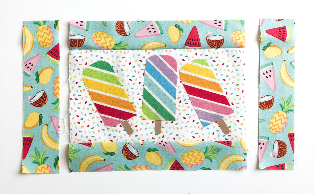 Free popsicle mug rug sewing tutorial with top US sewing blog Ameroonie Designs. Image of adding borders to mug rug.