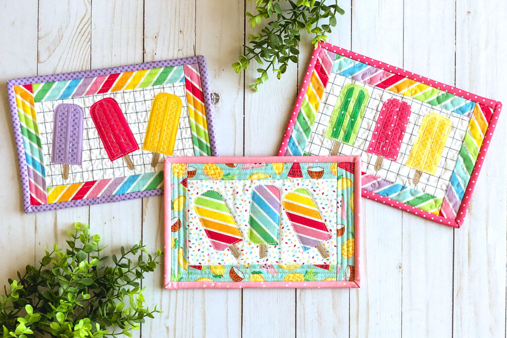 Free popsicle mug rug sewing tutorial with top US sewing blog Ameroonie Designs. Image of three mug rugs with applique popsicles.