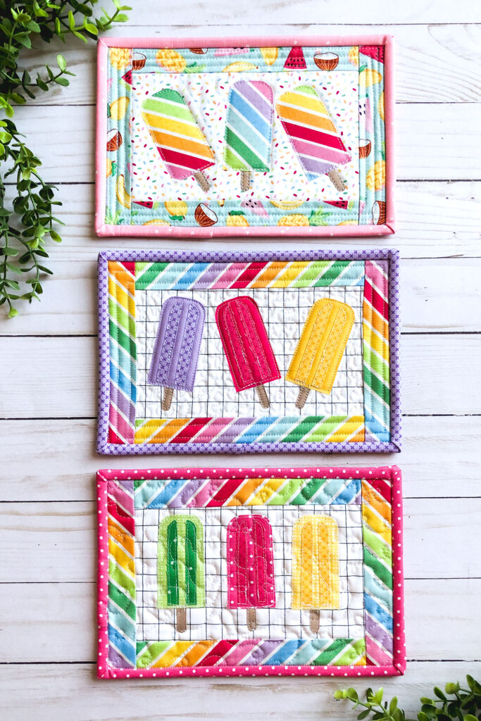 Free popsicle mug rug sewing tutorial with top US sewing blog Ameroonie Designs. Image of three popsicle mug rugs with greenery.