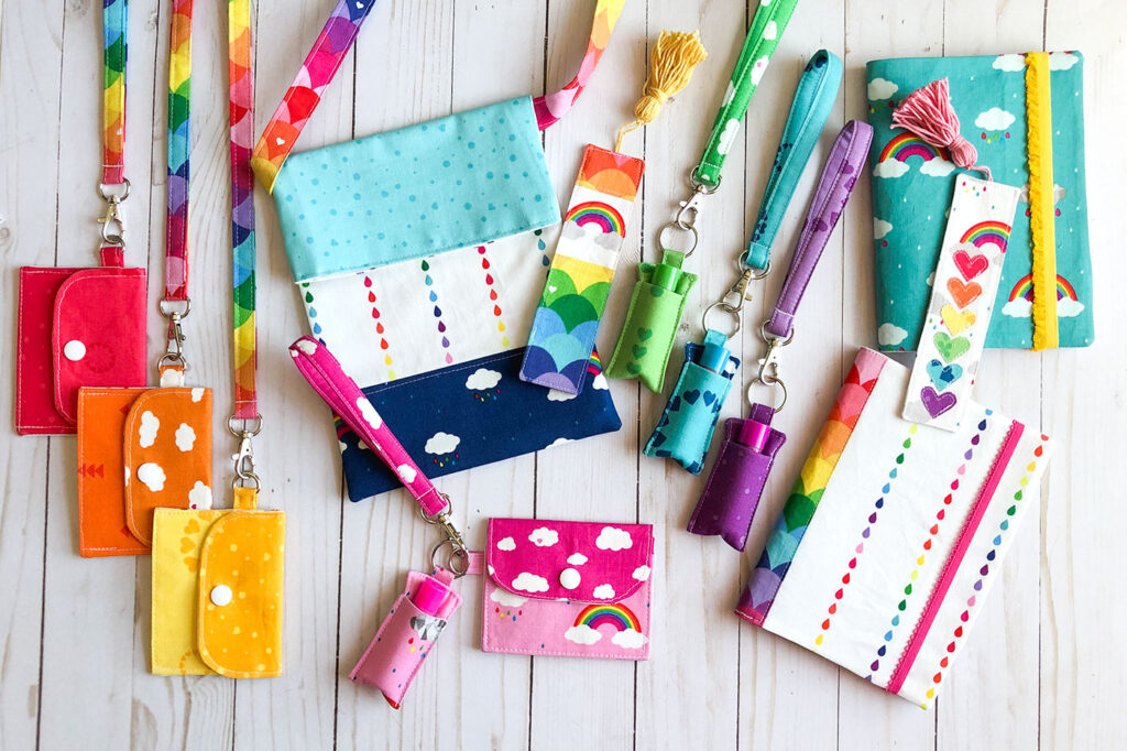 7 simple sewing projects to make this weekend from top US sewing blog Ameroonie Designs. Image of mini wallets, fabric lanyards, bookmarks, notebooks, tote bag, chapstick holder and keychains made from Dream fabric.