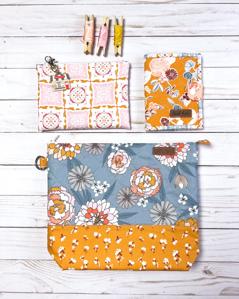 Practical projects to organize your hand sewing by Top US sewing blog Ameroonie Designs. Image of large and medium zipper pouches with quilted needle book.