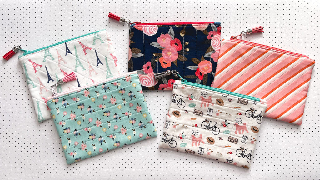 How to sew a simple zipper pouch with top US sewing blog Ameroonie Designs. Image of small zipper pouches in coordinating fabrics.