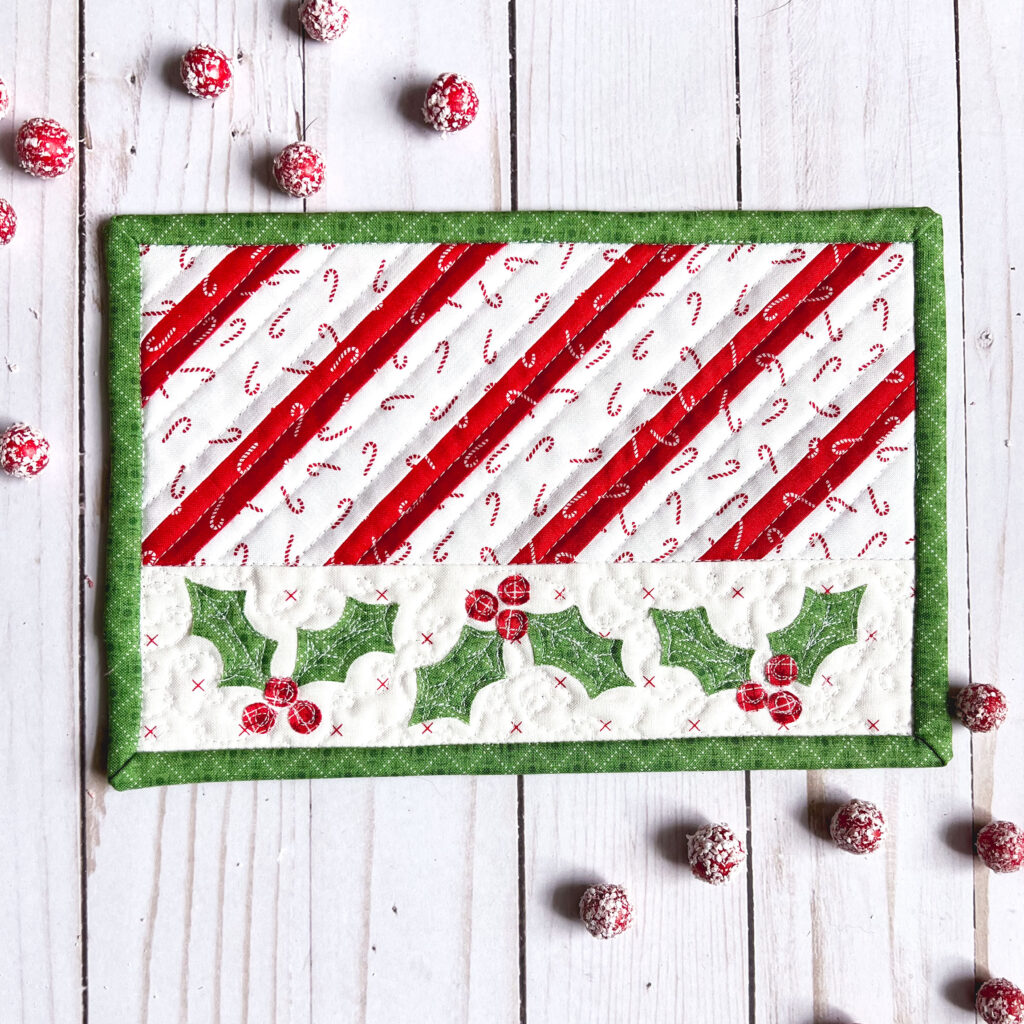 Five quick and easy tips for quilting small projects by Top US sewing blog Ameroonie Designs. Image of striped mug rug with holly and berry applique.