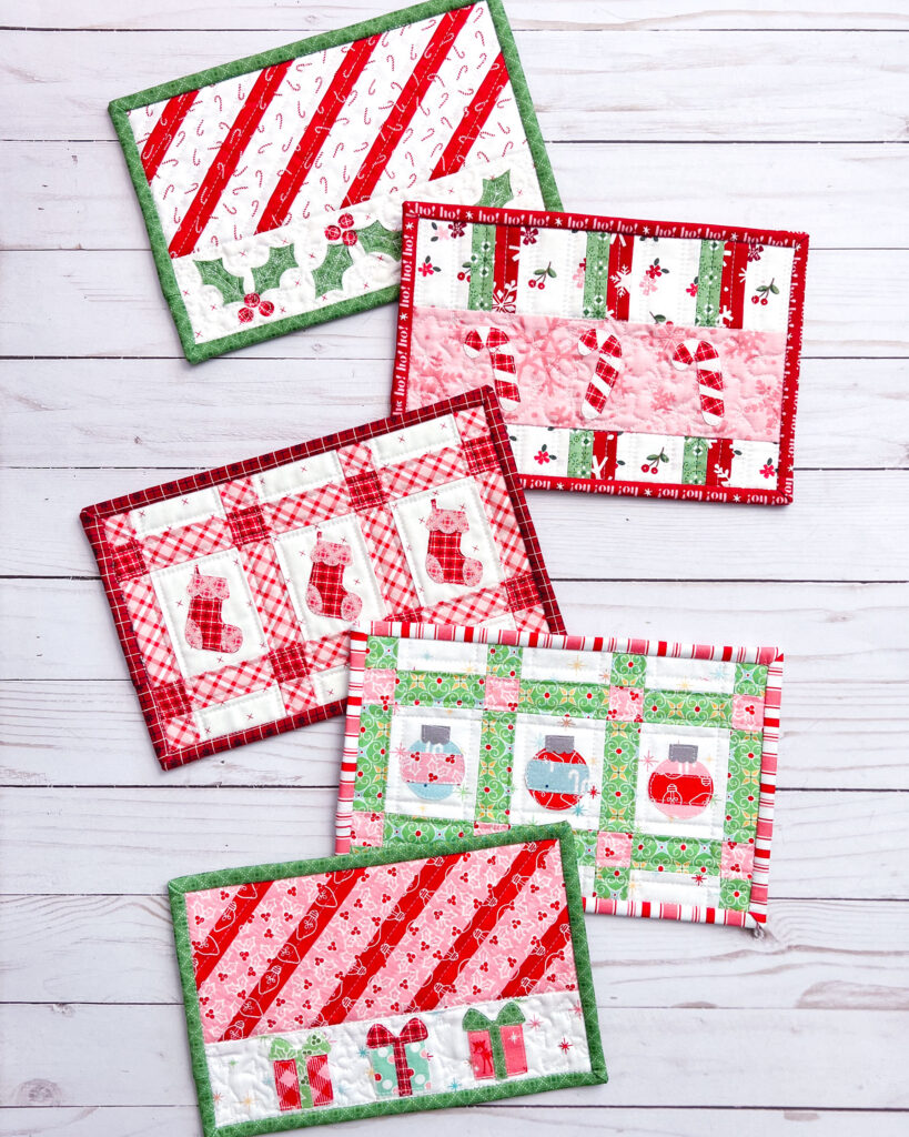 Five quick and easy tips for quilting small projects by Top US sewing blog Ameroonie Designs. Image of five Christmas themed mug rugs.