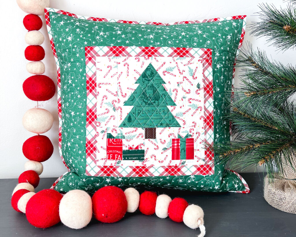 3 simple tips for staying sane when piecing small projects by Top US sewing blog Ameroonie Designs. Image of Quilted pillow with Christmas tree and presents showing results of accurate piecing.